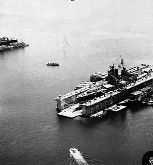 USS ABSD-5 at Manicani Island, Philippines repairing USS Mississippi in July 1945