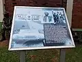 A plaque outside the Lubiri with details about the palace