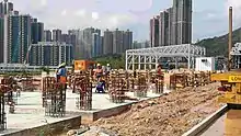 Workers installing building foundations
