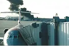 Flight 5481 (in background), shortly after impact