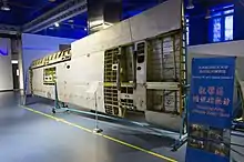 Aircraft wing with internal structure exposed and a sign reads "teaching area"