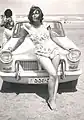 An Iranian poses in her swimsuit at a beach in the 1960s.