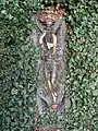 A glazed terracotta plaque approximately 40 metres (130&nbsp;ft) west of the fountain