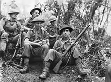 Soldiers rest in the jungle