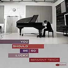 A photo of Tench at a grand piano