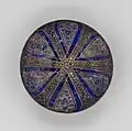 Bowl with radiating panels. Late 13th–early 14th century. Stonepaste with pigment and gilding over glaze. Yale University Art Gallery