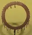 A bracelet made of brass, beads and mother of pearl