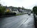 Bridgend Cottages and the A78 road bridge over Kip Water