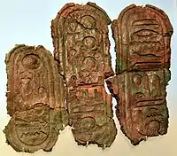 Bronze plate with a cartouche of the throne name of Akhenaten (left) and two late form cartouches for Aten (middle, right). Amarna, Egypt. New Kingdom, late 18th Dynasty.  Neues Museum, Berlin, Germany.