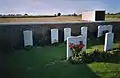 Gravestones at the rear of the cemetery, showing planting done by the CWGC.