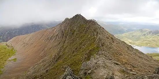 Image 10Crib GochPhoto: David IliffCrib Goch is an arête in Snowdonia national park, Wales, reaching 923 m (3,028 ft) above mean sea level. It is a popular destination for mountaineering, but even experienced climbers have suffered fatalities on it. It is also the wettest spot in the United Kingdom, with an average of 4,473 millimetres (176.1 in) rainfall a year over the past 30 years.More featured pictures