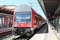 2. Generation Doppelstockwagen in DB Verkehrsrot&nbsp;[de] colours on a Rostock S-Bahn service (July 2013)