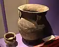 A large storage jar with cordmarked decorations and strap handles
