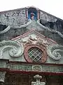 Details of window and pediment with a niche for a statue of Saint John the Baptist