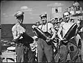 Crew of HMS&nbsp;Euryalus with shells, August 1942