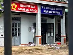 The photo shows rubble under a door at the site of the attack