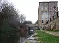View eastward under the Commercial Street bridge to Lock 1E