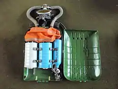 IDA-71 with lid of casing opened showing interior with counterlung, scrubber canisters and oxygen supply cylinder and regulator
