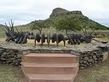 Image 5The monument to the Battle of Isandlwana depicts a beaded Zulu necklace similar to the one used for the original Wood Badge beads (from Wood Badge)
