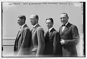 Gill standing in profile together with three of his polo teammates in 1922