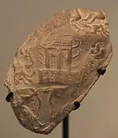 King-priest with bow fighting enemies, with horned temple in the center. Susa II or Uruk period (3800–3100 BC), found in excavations at Susa. Louvre Museum.