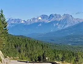 Distant view looking north at Mt. Verendrye (center) and Mt. Wardle (right)
