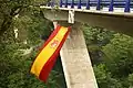 V-shaped bridge pillars and blue guardrail
