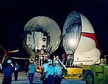 cased LM on airplane in hangar