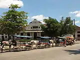 Marta Abreu train station, across the Martyrs Park. A line of horse drawn taxi carriages awaits their turn to fill up with travelers. Photo from 2010