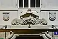 supraporta showing the insignia of the former shoemaker guild