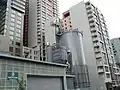 Wood handling building and storage silo