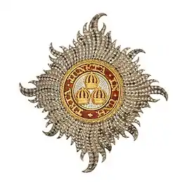 Civil Knight Grand Cross Star of The Most Honourable Order of the Bath: 'Rays of silver issuing from a centre and charged with three Imperial Crowns, one and two, within a circle gules whereon inscribed the motto of the Order in gold'.mw-parser-output cite.citation{font-style:inherit;word-wrap:break-word}.mw-parser-output .citation q{quotes:"\"""\"""'""'"}.mw-parser-output .citation:target{background-color:rgba(0,127,255,0.133)}.mw-parser-output .id-lock-free a,.mw-parser-output .citation .cs1-lock-free a{background:url("//upload.wikimedia.org/wikipedia/commons/6/65/Lock-green.svg")right 0.1em center/9px no-repeat}.mw-parser-output .id-lock-limited a,.mw-parser-output .id-lock-registration a,.mw-parser-output .citation .cs1-lock-limited a,.mw-parser-output .citation .cs1-lock-registration a{background:url("//upload.wikimedia.org/wikipedia/commons/d/d6/Lock-gray-alt-2.svg")right 0.1em center/9px no-repeat}.mw-parser-output .id-lock-subscription a,.mw-parser-output .citation .cs1-lock-subscription a{background:url("//upload.wikimedia.org/wikipedia/commons/a/aa/Lock-red-alt-2.svg")right 0.1em center/9px no-repeat}.mw-parser-output .cs1-ws-icon a{background:url("//upload.wikimedia.org/wikipedia/commons/4/4c/Wikisource-logo.svg")right 0.1em center/12px no-repeat}.mw-parser-output .cs1-code{color:inherit;background:inherit;border:none;padding:inherit}.mw-parser-output .cs1-hidden-error{display:none;color:#d33}.mw-parser-output .cs1-visible-error{color:#d33}.mw-parser-output .cs1-maint{display:none;color:#3a3;margin-left:0.3em}.mw-parser-output .cs1-format{font-size:95%}.mw-parser-output .cs1-kern-left{padding-left:0.2em}.mw-parser-output .cs1-kern-right{padding-right:0.2em}.mw-parser-output .citation .mw-selflink{font-weight:inherit}Montague-Smith, P.W., ed. (1968). Debrett's Peerage, Baronetage, Knightage and Companionage. Kingston-upon-Thames: Kelly's Directories Ltd. p. 896.