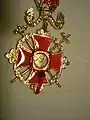 Backside: relic in shape of a rock from Calvary, including the seal of the Patriarch.