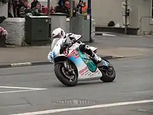 2014 Isle of Man TT&nbsp; TT Zero Practice Session Bruce Anstey (5) Shinden San / Team Mugen at Parliament Square, Ramsey 1 June 2013.