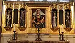 The statues in this reredos at St John the Divine, Richmond, London  are by MacDonald Gill