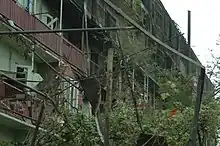 A burnt apartment building where 16 people were reportedly killed