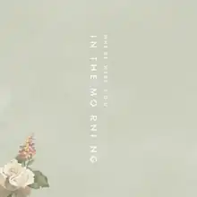 The cover consists of a floral design in the lower left corner with the title spelled out vertically in the centre in two columns