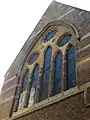 A window of the former parish church of St Michael, Leonard Street, London.