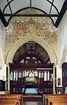 Chancel arch and painting of the twelve apostles.