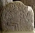 Stela showing "Isis the Great Goddess" sitting and holding a was-sceptre. A man, the head of necropolis workers, adores her. Middle Kingdom of Egypt, Petrie Museum of Egyptian Archaeology, London