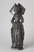 Mourner from the  mid 15th-century Tomb of Isabella of Bourbon wearing a truncated linen hennin.
