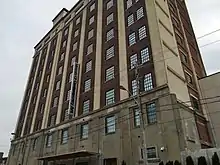 Exterior eastern facade of the Tower Automotive Building from the ground