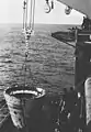 USS Guam recovers space shuttle SRB nose cone in 1986.