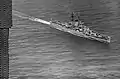 USS Rochester passing the Golden Gate Bridge in 1958.