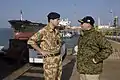 Desert Combat Dress worn by a Royal Navy officer on the left, in 2006.