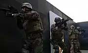 Students at SQT conduct a room clearing exercise.