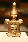 Lime container; 5th-9th century; gold; 23&nbsp;cm (9&nbsp;in) high; Metropolitan Museum of Art (New York City). Likely used by a member of the Quimbaya elite