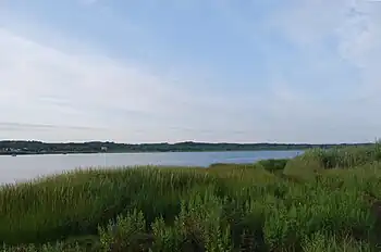Winnapaug Pond (also known as Brightman Pond) is a breached saltwater pond in Westerly, Rhode Island, United States, connected to Block Island Sound by the Weekapaug Breachway, which was constructed during the mid-1950s. The 2.5-mile (4.0&nbsp;km) long lake is separated from the Atlantic by a large sandbar.