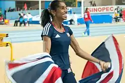 Yamilé Aldama celebrating her win after the triple jump.