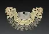 Moche nose ornament made from silver and gold-silver alloy, inlaid with malachite, now at the Cleveland Museum of Art, United States.